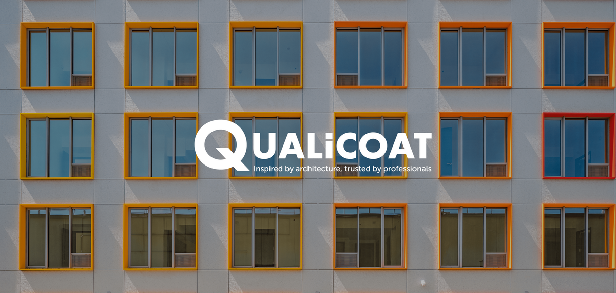 Qualicoat logo in front of colourful windows.